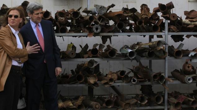 US Senate Foreign Relations Committee Chairman John Kerry, with then foreign minister and Kadima party leader Tzipi Livni, stand next to the remains of rockets fired from Gaza, at a police station in Sderot, in Feb. 2009. (photo credit: Tsafrir Abayov/Flash90)