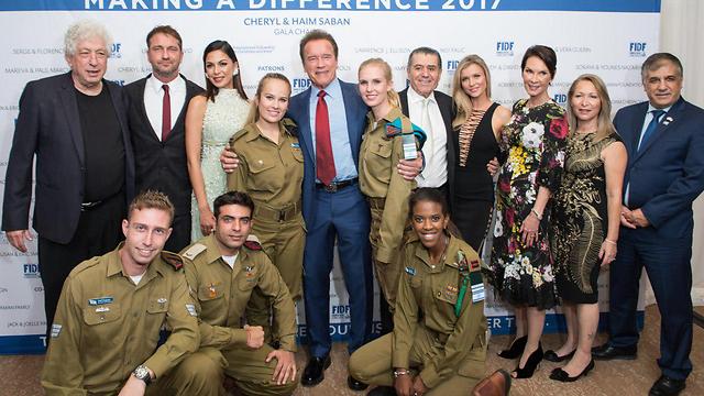 Arnold Schwarzenegger and Gerard Butler with IDF soldiers at the FIDF Gala in 2017