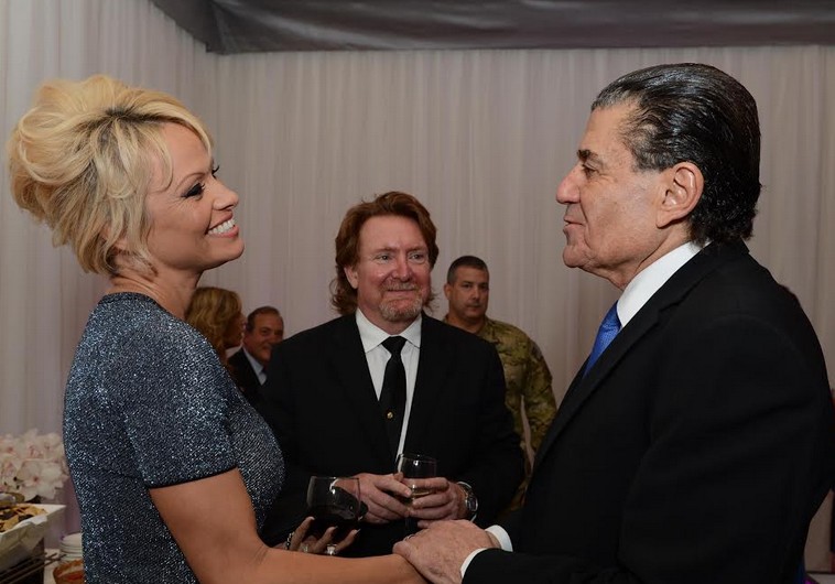 Actress Pamela Anderson with Haim Saban at the Friends Of The Israel Defense Forces (FIDF) Gala in 2014. 