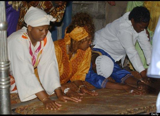 Whitney Houston and Bobby Brown pray in the Church of the Holy Sepulchre in Jerusalem's Old City.