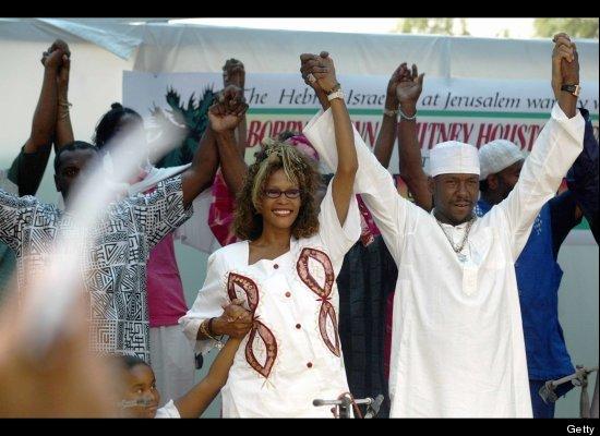 Whitney Houston and her husband Bobby Brown arrive in the southern town of Dimona, Israel.